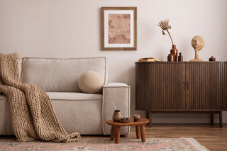 Mid century modern living room with walnut furniture, neutral sofa and warm natural tones