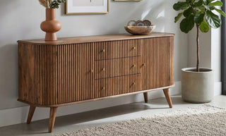 Mid century modern wooden cabinet used for storage in a stylish interior