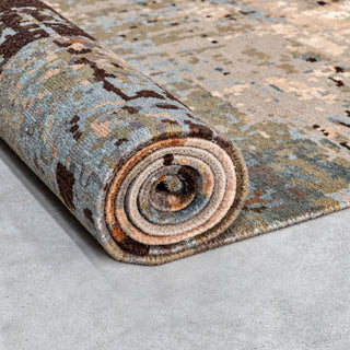 abstract-wool-rug-partly-rolled-pile-detail.webp