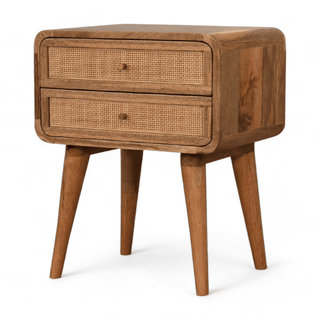 Angled perspective of a mid-century nightstand highlighting two rattan drawers and tapered wooden legs, exuding vintage charm.