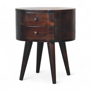 Angled view of the round walnut nightstand highlighting its two-drawer design and modern aesthetic.