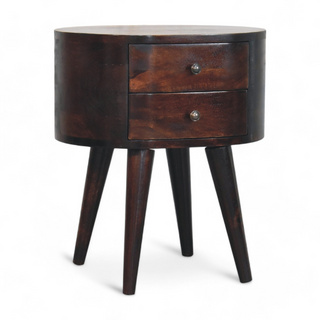 Angled view of the round walnut nightstand highlighting its two-drawer design and modern aesthetic.