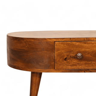 Close-up of the oval edge of the coffee table, showcasing its smooth wooden texture and craftsmanship.
