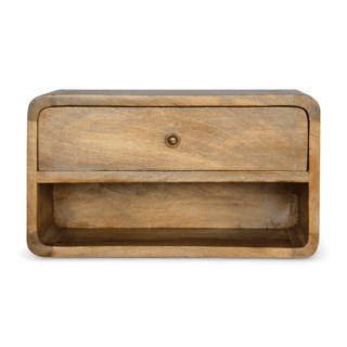 Front view of a floating nightstand in solid mango wood with a drawer and open shelf.

