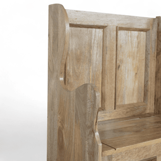 Side profile of a high-backed mango wood settle bench with wing side and panelled seat base