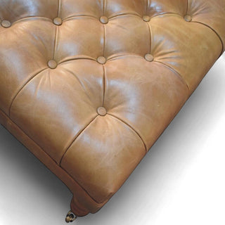 Buffalo Tan Leather Ottoman with Castor Legs