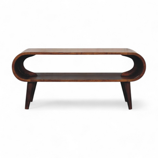 Front view of a mid-century modern coffee table with curved wood design and open storage shelf, crafted from solid mango wood.