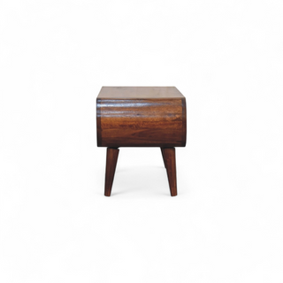 Side view of the coffee table displaying the seamless curved wood design and craftsmanship.