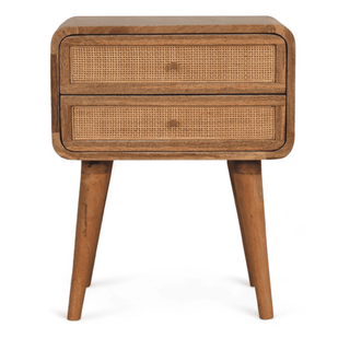 Front view of a mid-century modern nightstand with rattan drawer fronts, crafted from mango wood, showcasing its sleek and rounded edges.
