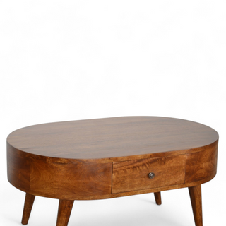 Top angled view of the oval wooden coffee table emphasizing its polished wooden surface and compact design.