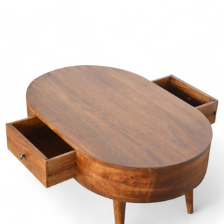 Top view of the oval wooden coffee table with both drawers fully open, revealing spacious storage compartments and a polished wooden surface.