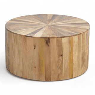 Side angle of a round coffee table showcasing the detailed sunburst wood design on the top and vertical wooden panels.
