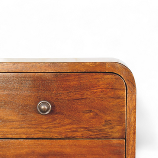 Side view of the chestnut-finished nightstand displaying its curved edges and smooth surface.