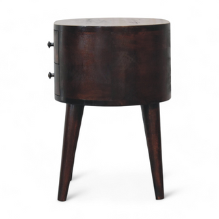 Side view of the round walnut nightstand showcasing its smooth finish and compact structure.