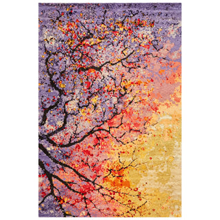 A rectangular area rug featuring an abstract tree design with black branches and colorful autumn-like leaves in red, orange, yellow, and white against a purple and beige background.
