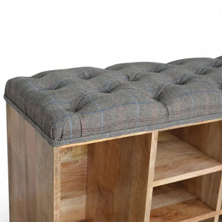 End view of a mango wood shoe bench showing the tufted cushioned top and open side storage compartment