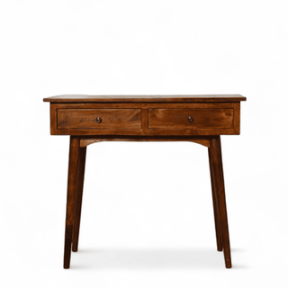 Front view of a vintage mid-century modern writing desk in dark mango wood, featuring two drawers with round knobs and tapered legs.