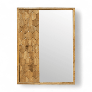 Front view of a wooden mirror cabinet with a hexagonal carved design on one side and a sliding mirror door.