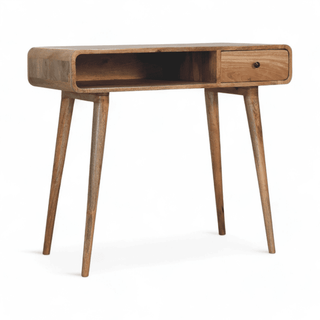 Right-angle view of a vintage mid-century modern writing desk highlighting its storage drawer and open shelf.