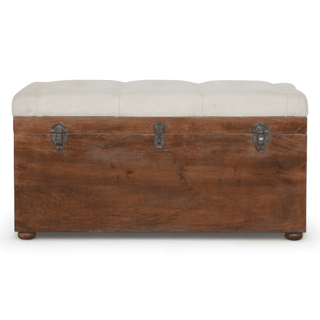 Front view of a Vintage Wooden Storage Ottoman with a tufted white upholstered top and metal latch details.