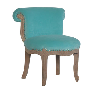 Angled view of Aqua Velvet Studded Chair, showing the upholstered seat, legs and silhouette
