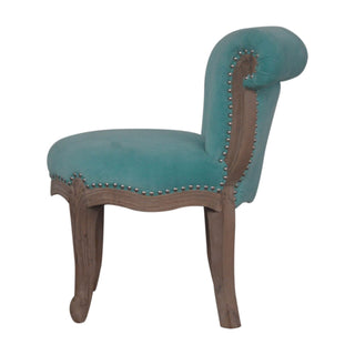 Rear angle view of Aqua Velvet Studded Chair, showing the upholstered seat, legs and silhouette