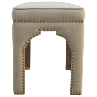 Seat detail view of Arco Hallway Bench Mud Linen Fully Upholstered Arched Cut-Out Legs Antique Stud Trim