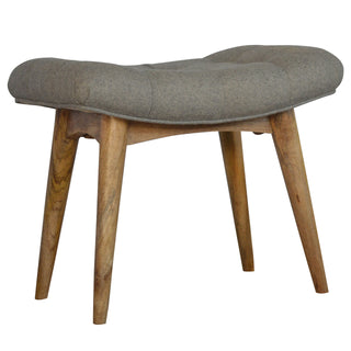Angled view of Ash Upholstered Bench Grey Tweed Curved Saddle Seat Weathered Grey Wash Nordic Legs