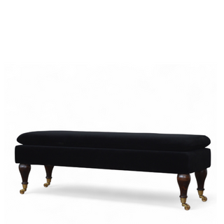 Side view of Black Velvet Upholstered Bench with Castor Legs, showing the upholstered seat, legs and silhouette