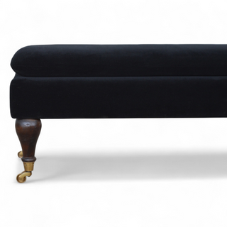 Seat detail view of Black Velvet Upholstered Bench with Castor Legs, showing the upholstered seat, legs and silhouette