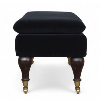 Additional angle of Black Velvet Upholstered Bench with Castor Legs, showing the upholstered seat, legs and silhouette