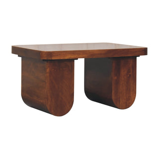 Side angle view of Brut Coffee Table Solid Mango Wood Chunky Arch Pedestal Legs Chestnut