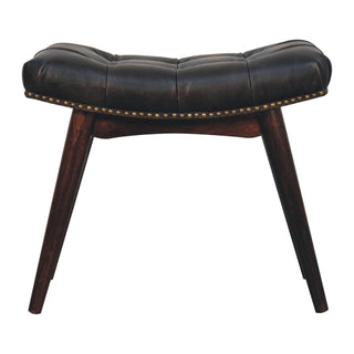 Front view of Cali Upholstered Bench Black Buffalo Leather Button Tufted Curved Saddle Brass Studs California Walnut