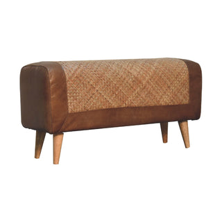 Side angle view of Cayo Hallway Bench Seagrass Woven Panel Buffalo Hide Leather Rim Chestnut Nordic Legs