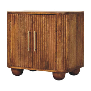 Side angle view of Cleo Compact Sideboard Cabinet with Fluted Front and Bun Feet