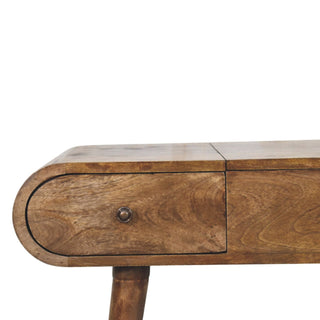 Close-up of finish detail on Contour Curve Dressing Table, showing the tabletop, frame and furniture finish