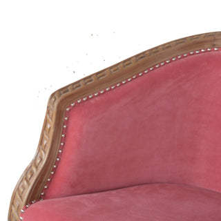 Close-up of fabric texture on Coral Accent Chair Pink Velvet Studded Open Frame Turned Leg