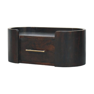 Side angle view of Curved Front Wall Nightstand, showing the storage shape and furniture finish
