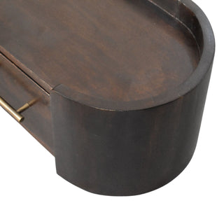 Finish detail view of Curved Front Wall Nightstand, showing the storage shape and furniture finish