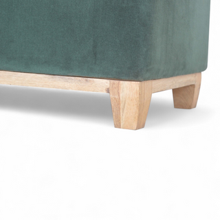 Leg detail view of Emerald Green Velvet Storage Ottoman Box, showing the upholstered seat, legs and silhouette