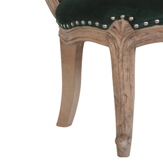 Angled view of Emerald Green Velvet Studded Chair, showing the upholstered seat, legs and silhouette
