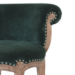 Close-up of fabric texture on Emerald Green Velvet Studded Chair, showing the upholstered seat, legs and silhouette