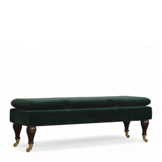 Angled view of Emerald Velvet Storage Bench with Castor Legs, showing the upholstered seat, legs and silhouette