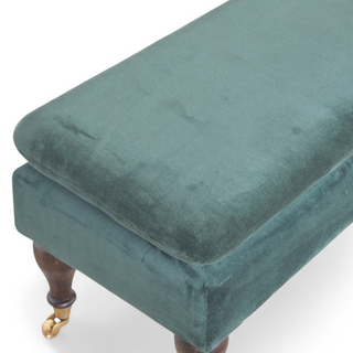 Seat detail view of Emerald Velvet Storage Bench with Castor Legs, showing the upholstered seat, legs and silhouette