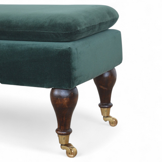 Rear angle view of Emerald Velvet Storage Bench with Castor Legs, showing the upholstered seat, legs and silhouette
