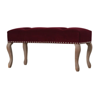 Angled view of Garnet Bedroom Bench Wine Red Velvet Button Tufted Scalloped Edge Antique Studs French Cabriole