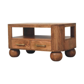 Side angle view of Grove Coffee Table with Drawers Solid Mango Wood Fluted Sides Ball Feet Golden Teak