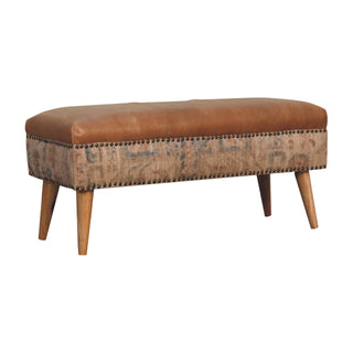 Angled view of Indie Hallway Bench Tan Buffalo Leather Seat Dhurrie Fabric Sides Brass Studs Oak Legs