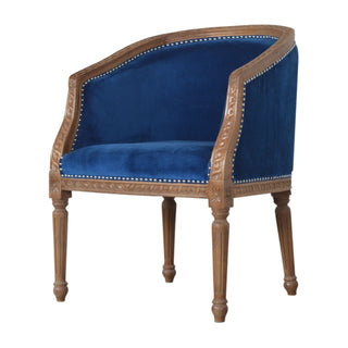 Angled view of Indigo Accent Chair Royal Blue Velvet Studded Open Frame Turned Leg