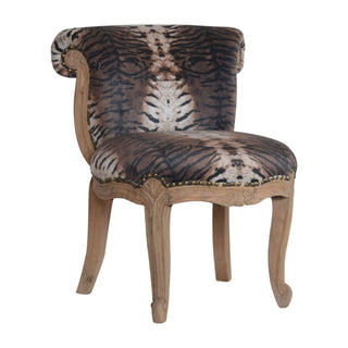 Angled view of Leona Accent Chair Tiger Print Studded Scroll Back Cabriole